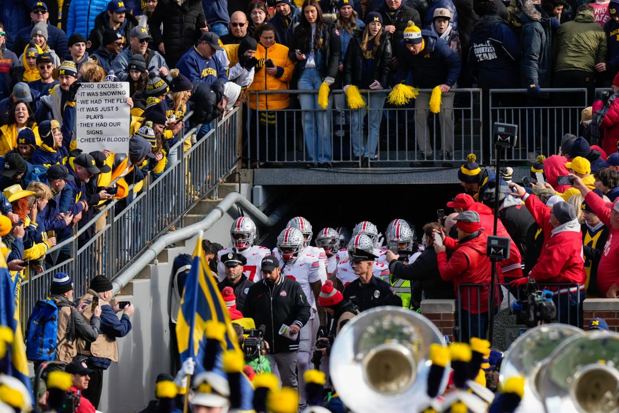 Nov 25, 2023; Ann Arbor, Michigan, USA; The Ohio State Buckeyes enter through the tunnel prior to the NCAA football game against the Michigan Wolverines at Michigan Stadium.