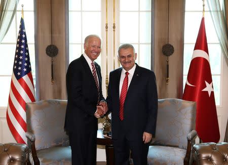 Turkish Prime Minister Binali Yildirim (R) meets with U.S. Vice President Joe Biden in Ankara, Turkey, August 24, 2016. Hakan Goktepe/Prime Minister's Press Office/Handout via REUTERS