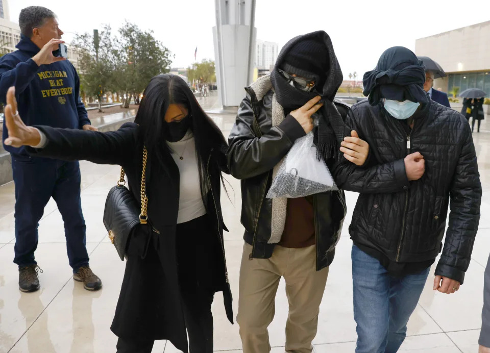 FILE - Alexander Smirnov, second from right, leaves the courthouse on Feb. 20, 2024, in Las Vegas. The FBI informant who was once held up by Republicans as a credible source of information about Hunter Biden now finds himself charged with lying to federal authorities. Smirnov is accused of fabricating a tale of bribery and espionage involving the then-vice president and the Ukrainian energy company Burisma and has claimed to have ties to Russian intelligence operatives. (Bizuayehu Tesfaye/Las Vegas Review-Journal via AP, File)