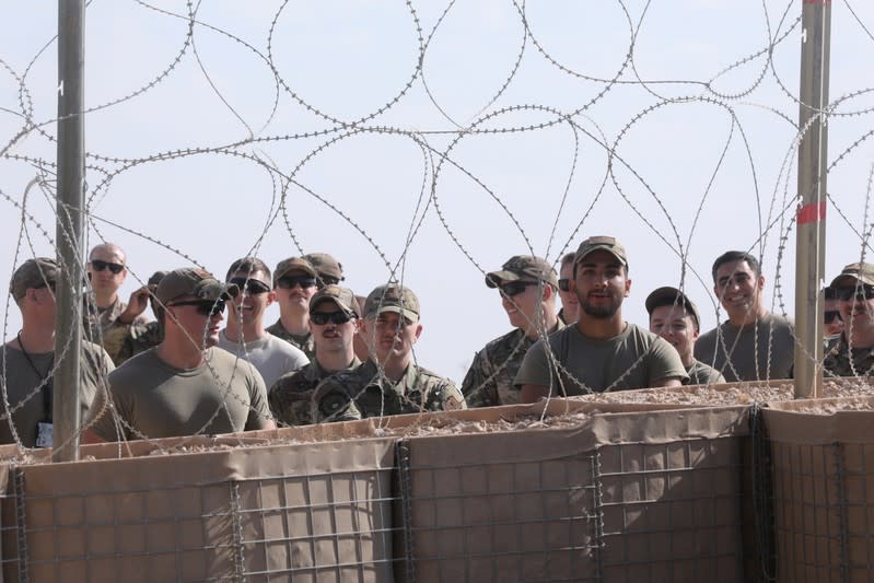 U.S. soldiers gather as U.S. Vice President Mike Pence arrives for meetings at Al Asad Air Base