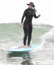 <p>Leighton Meester dives into a surf session in Malibu, California on Thursday with her husband, Adam Brody. </p>