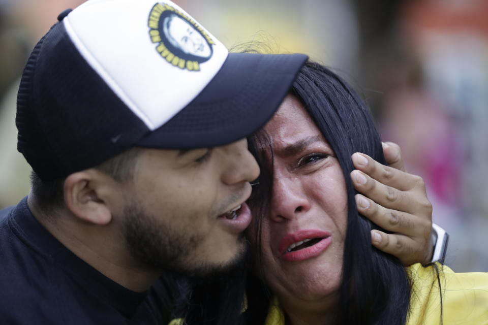 Supporters of presidential candidate Rodolfo Hernandez, with the Anti-corruption Governors League, cry after former leftist rebel Gustavo Petro won a presidential runoff election in Bucaramanga, Colombia, Sunday, June 19, 2022. (AP Photo/Ivan Valencia)