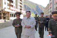 North Korean leader Kim Jong Un inspects a damage recovery site affected by heavy rains and winds caused by recent typhoons, in Geomdeok district, South Hamgyong