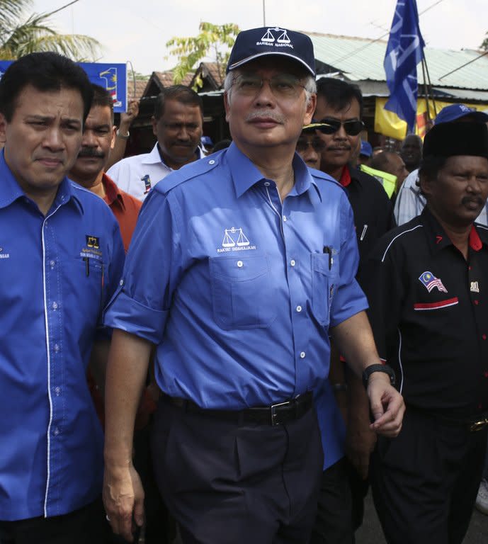 Malaysia's Prime Minister Najib Razak (C), president of the ruling National Front party, pictured during an election rally in Kuala Lumpur, on April 22, 2013. Najib and opposition leader Anwar Ibrahim on April 20 kicked off their campaigns for the May 5 election, likely to be the country's closest ever