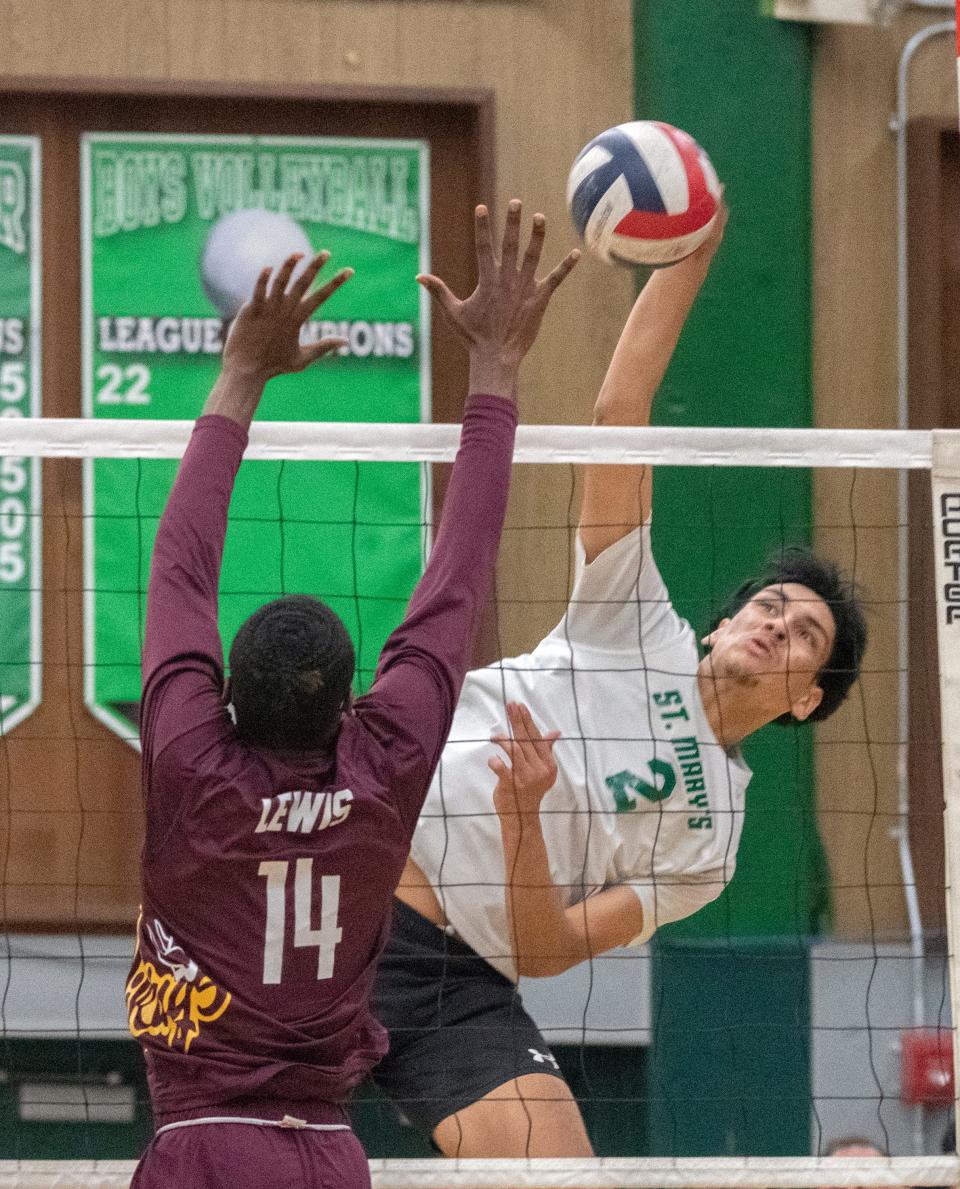 St. Mary's Daniel Huerta, right, spikes the ball on Edison's Rashad Lewis during a Sac-Joaquin Section boys volleyball playoff match at St. Mary's in Stockton on May. 2, 2024. St. Mary's won 3-1.