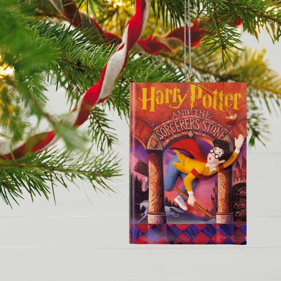 <p>The <em>Harry Potter</em> books are the gifts that keep on giving. This year, we’re hoping for a Hogwarts holiday and one of Mrs. Weasley’s knitted sweaters.</p> <p><strong>Shop Now:</strong> <em>Harry Potter and the Sorcerer’s Stone</em> 20th Anniversary Ornament, $18, <a rel="nofollow noopener" href="https://www.hallmark.com/ornaments/keepsake-ornaments/harry-potter-and-the-sorcerers-stone-20th-anniversary-ornament-1799QXI3436.html?source=igodigital" target="_blank" data-ylk="slk:www.hallmark.com;elm:context_link;itc:0;sec:content-canvas" class="link ">www.hallmark.com</a></p>