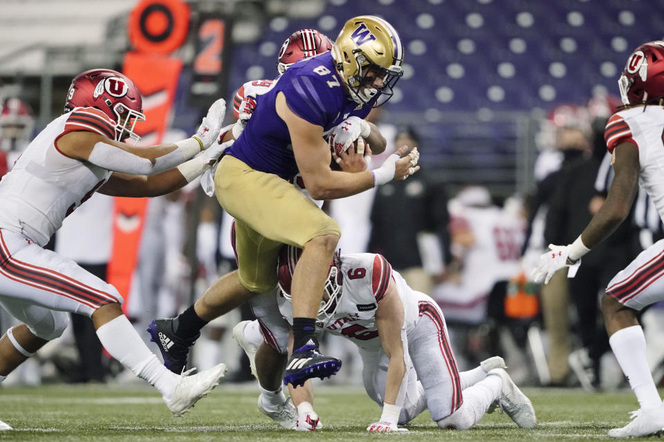 Washington tight end Cade Otton carries the ball against Utah during the second half of an NCAA college football game Saturday, Nov. 28, 2020, in Seattle. Washington won 24-21. (AP Photo/Ted S. Warren)