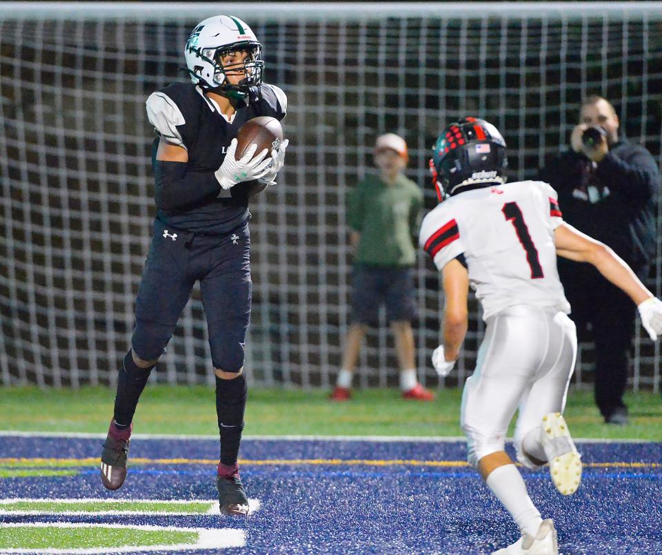 Mercyhurst Prep's Stephen Grayson, left, catches the go-ahead touchdown against Northwestern during  a District 10, Region 6 football game in Millcreek Township on Sept. 16, 2022.  