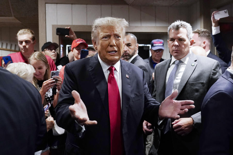 FILE - Former President Donald Trump greets supporters before speaking at the Westside Conservative Breakfast, June 1, 2023, in Des Moines, Iowa. As Ron DeSantis embarked on the first official week of his presidential candidacy, the Florida governor repeatedly hit his chief rival, Trump, from the right. (AP Photo/Charlie Neibergall, File)