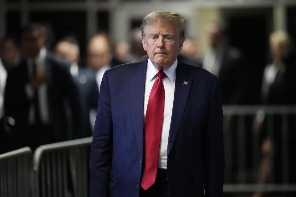 Former President Donald Trump leaves Manhattan criminal court, Thursday, Feb. 15, 2024, in New York. A New York judge says Trump's hush-money trial will go ahead as scheduled with jury selection starting on March 25. (AP Photo/Mary Altaffer)