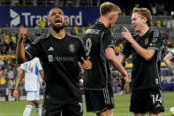 Nashville SC midfielder Hany Mukhtar, celebrates a goal by teammate Sam Surridge (9) during the second half of an MLS soccer match against CF Montréal, Saturday, May 4, 2024, in Nashville, Tenn. Nashville SC won 4-1. (AP Photo/George Walker IV)