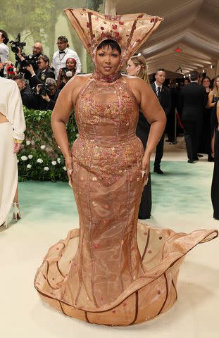 <p> Dia Dipasupil/Getty </p> Lizzo turns heads in a Victor Weinsanto botanical ensemble at the 2024 Met Gala