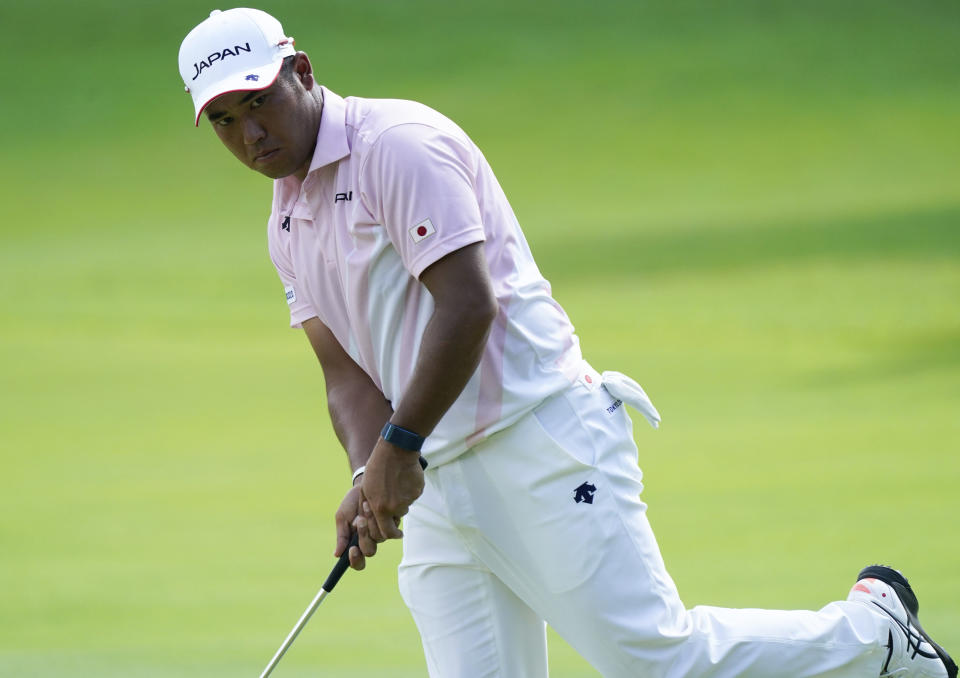 Hideki Matsuyama of Japan reacts after missing a putt on the 13th hole during the third round of the men's golf event at the 2020 Summer Olympics on Saturday, July 31, 2021, in Kawagoe, Japan. (AP Photo/Matt York)