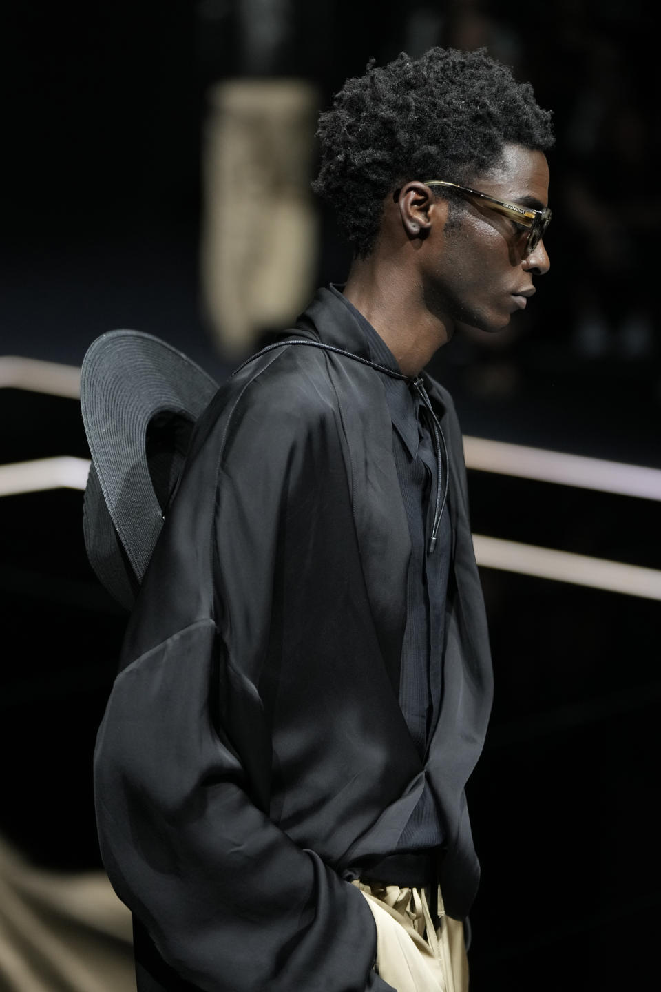 A model wears a creation as part of the Emporio Armani men's Spring Summer 2024 collection presented in Milan, Italy, Saturday, June 17, 2023. (AP Photo/Luca Bruno)