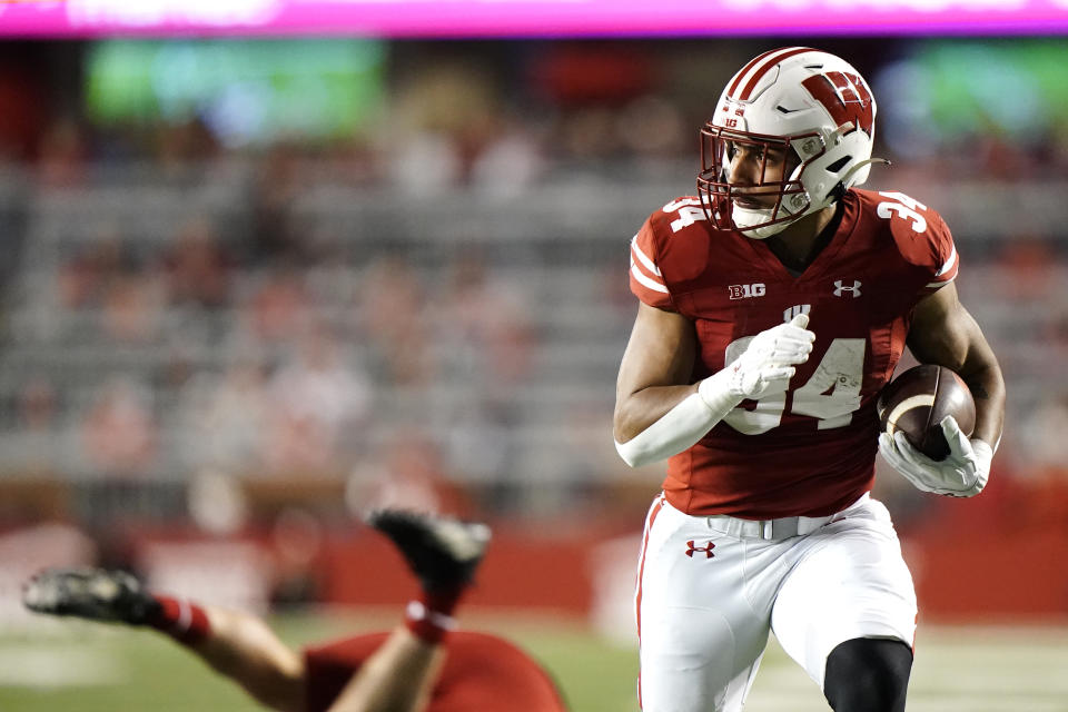 Wisconsin's Jackson Acker runs into the end zone for a touchdown after making a catch during the first half of an NCAA college football game against Nebraska Saturday, Nov. 18, 2023 in Madison, Wis. (AP Photo/Aaron Gash)