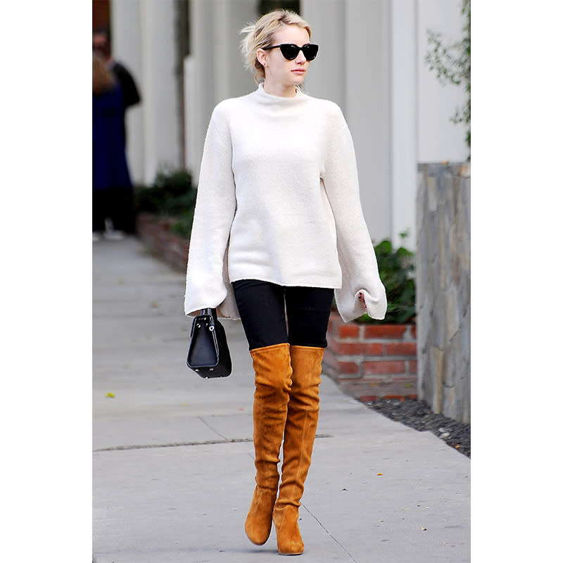 In A Forever 21 Sweater And Stuart Weitzman Boots