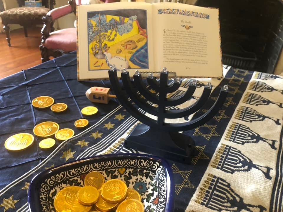 Study decorated by Congregation Brith Achim at Centre Hill Museum's 2022 Holiday Showcase in Petersburg, Va. The room's theme is the presentation of Hanukkah as celebrated with the traditional menorah and dreidel.