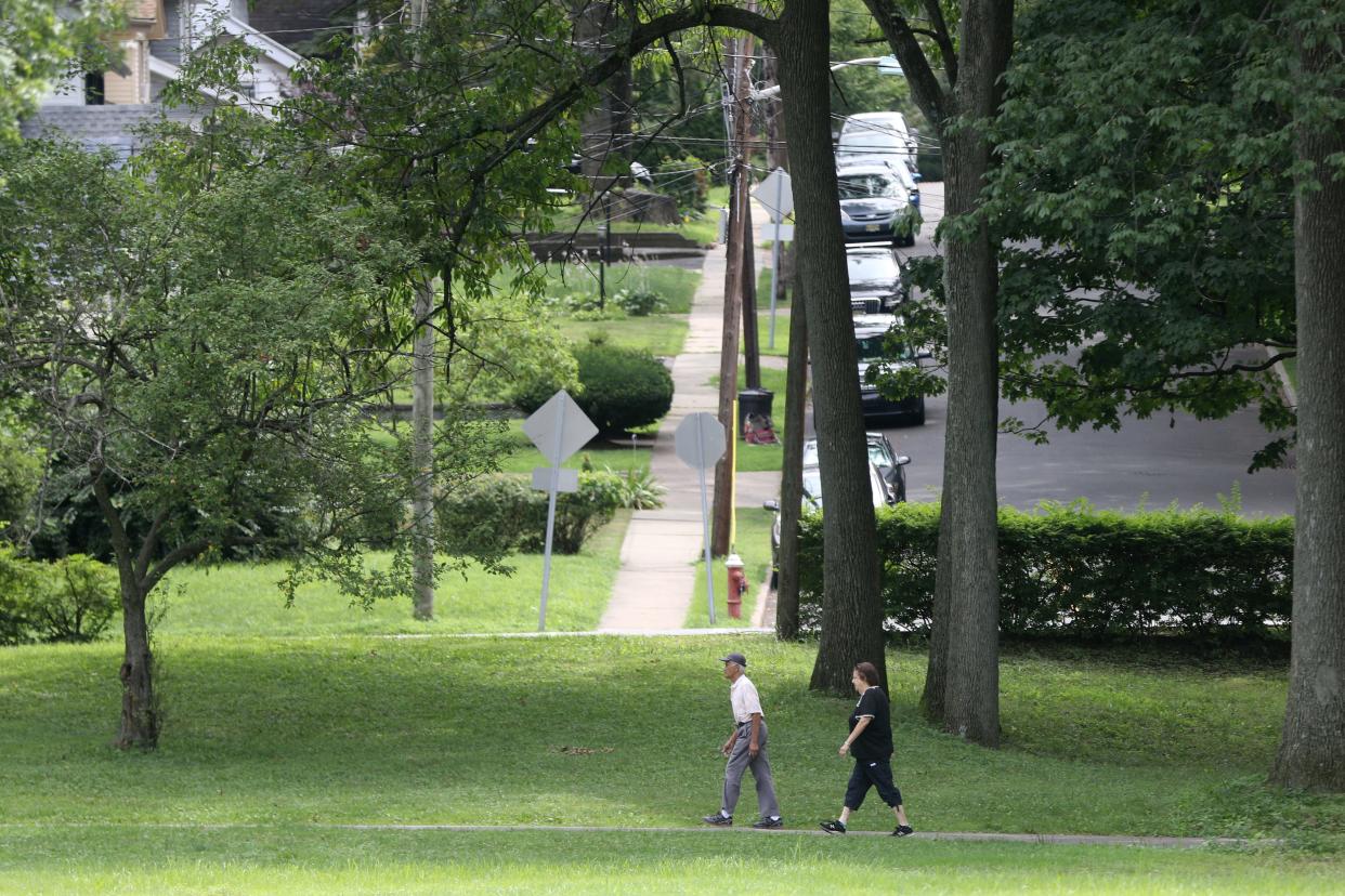 People are shown walking in Milton Votee Park, in Teaneck, on a summer day with lower than normal humidity and high's in the low- mid 80's.  Monday, August 5, 2019