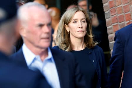 Actress Felicity Huffman and husband William H. Macy leave the federal courthouse in Boston