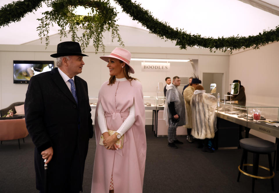 Eamonn Holmes is seen using a walking stick as he attends the Cheltenham Festival with GB News co-host Isabel Webster in March 2022. (Getty Images)