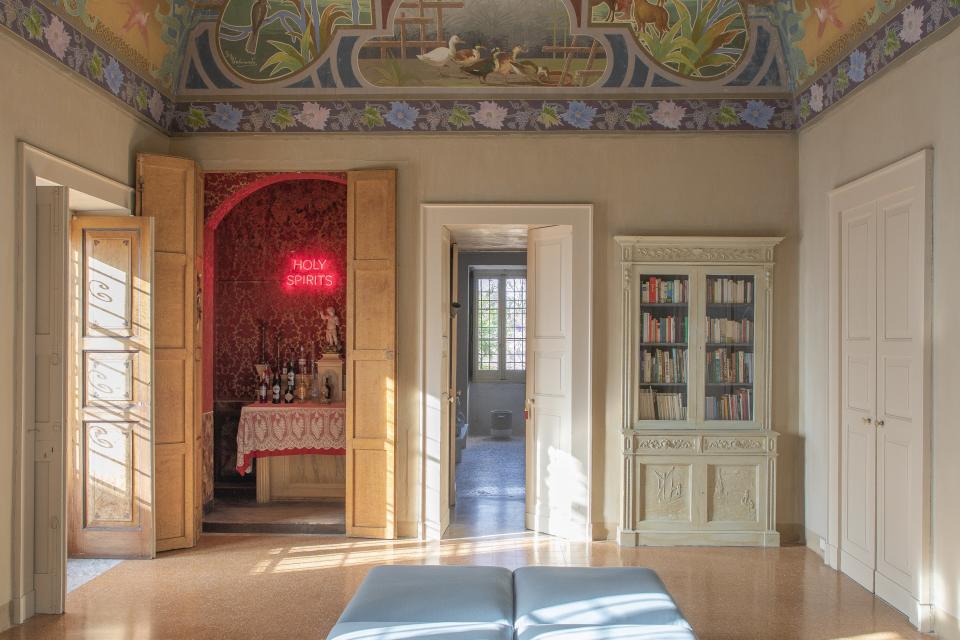 A common room at Palazzo Daniele with the hotel’s honesty bar.