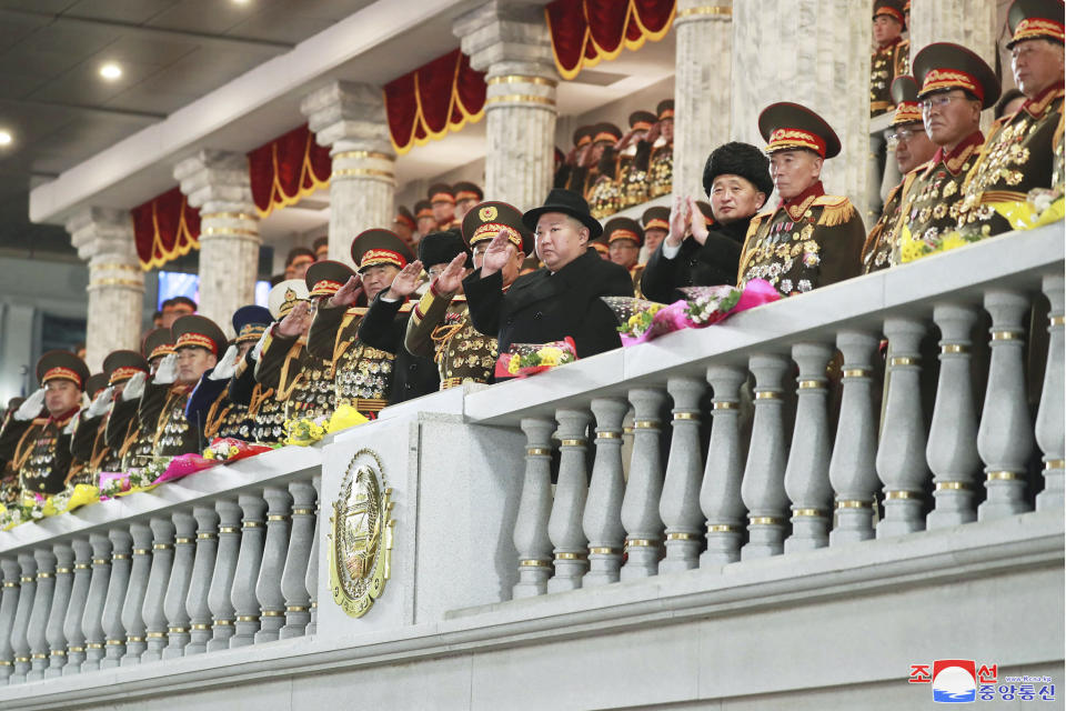 In this photo provided by the North Korean government, North Korean leader Kim Jong Un, center right, sixth from right, salutes as he watches a military parade at Kim Il Sung Square in Pyongyang, North Korea, Wednesday, Feb. 8, 2023. Independent journalists were not given access to cover the event depicted in this image distributed by the North Korean government. The content of this image is as provided and cannot be independently verified. Korean language watermark on image as provided by source reads: "KCNA" which is the abbreviation for Korean Central News Agency. (Korean Central News Agency/Korea News Service via AP)