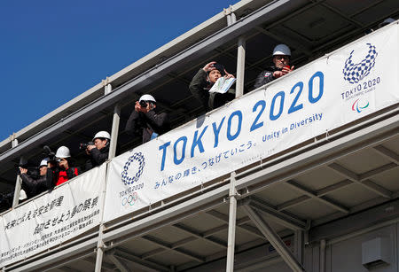 Media members report at the construction site of the Kasai Canoe Slalom Centre for Tokyo 2020 Olympic games in Tokyo, Japan February 12, 2019. REUTERS/Issei Kato