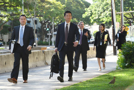 Hawaii Attorney General Douglas Chin (R) arrives at the U.S. District Court Ninth Circuit to seek an extension after filing an amended lawsuit against President Donald Trump's new travel ban in Honolulu. REUTERS/Hugh Gentry