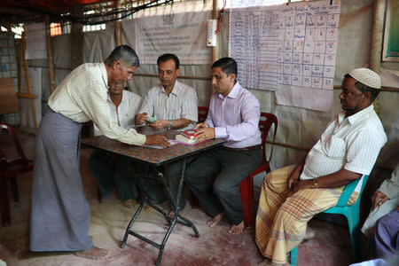 Mohib Ullah (2nd from right), a leader of Arakan Rohingya Society for Peace and Human Rights, attend a meeting of the organization in Kutupalong camp in Cox's Bazar, Bangladesh April 7, 2019. Picture taken April 7, 2019. REUTERS/Mohammad Ponir Hossain