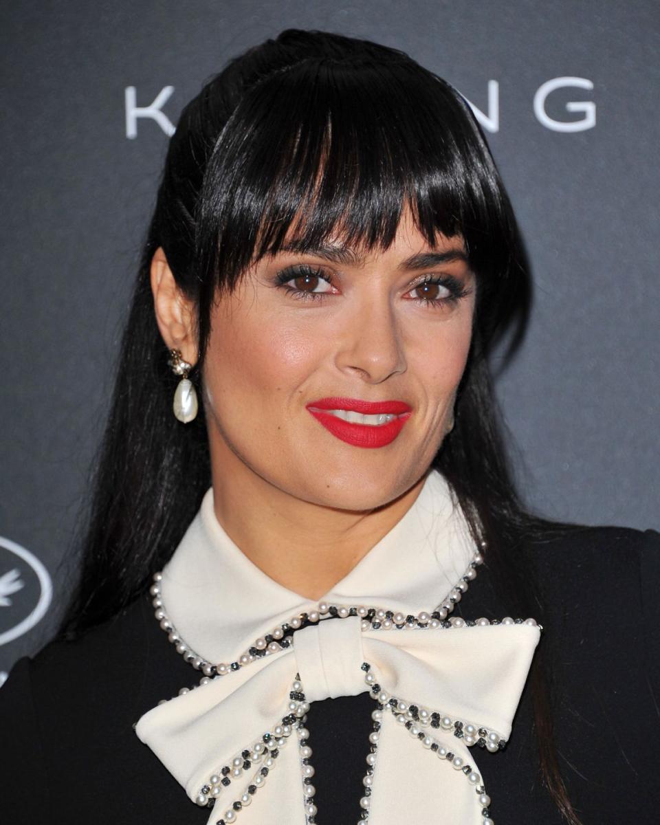 <p>The queen of Cannes transformations, Salma's fringe adds a French twist to her monochrome look.</p>