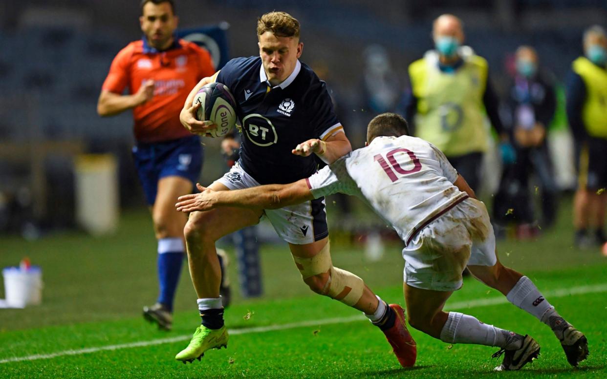 Scotland's wing Darcy Graham (L) takes on Georgia's fly-half Tedo Abzhandadze (R) during the Autumn International rugby union Test match between Scotland and Georgia - AFP