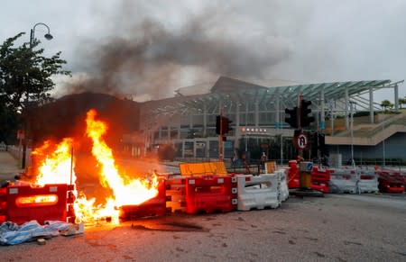 A burning barricade is pictured during a protest near a metro station in Hong Kong