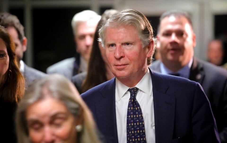 In this Feb. 14, 2020 file photo, Manhattan District Attorney Cyrus Vance Jr., center, leaves Harvey Weinstein's rape trial at Criminal Court, in New York. Vance, leading a criminal probe into Donald Trump's business dealings, said March 12, 2021, he would not seek re-election.