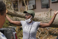 Linda Smoot, who evacuated from Hurricane Laura in a pickup truck with eight others, reacts outside her sister's home, as they return to see their homes for the first time, in Lake Charles, La., in the aftermath of the hurricane, Sunday, Aug. 30, 2020. (AP Photo/Gerald Herbert)