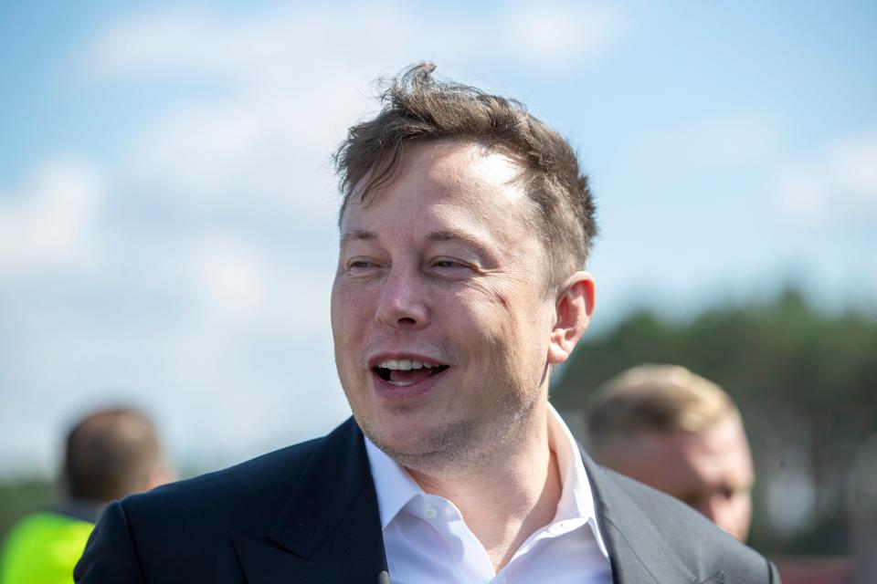 <p>Tesla head Elon Musk talks to the press as he arrives to to have a look at the construction site of the new Tesla Gigafactory near Berlin on September 03, 2020 near Gruenheide, Germany</p> (Getty Images)