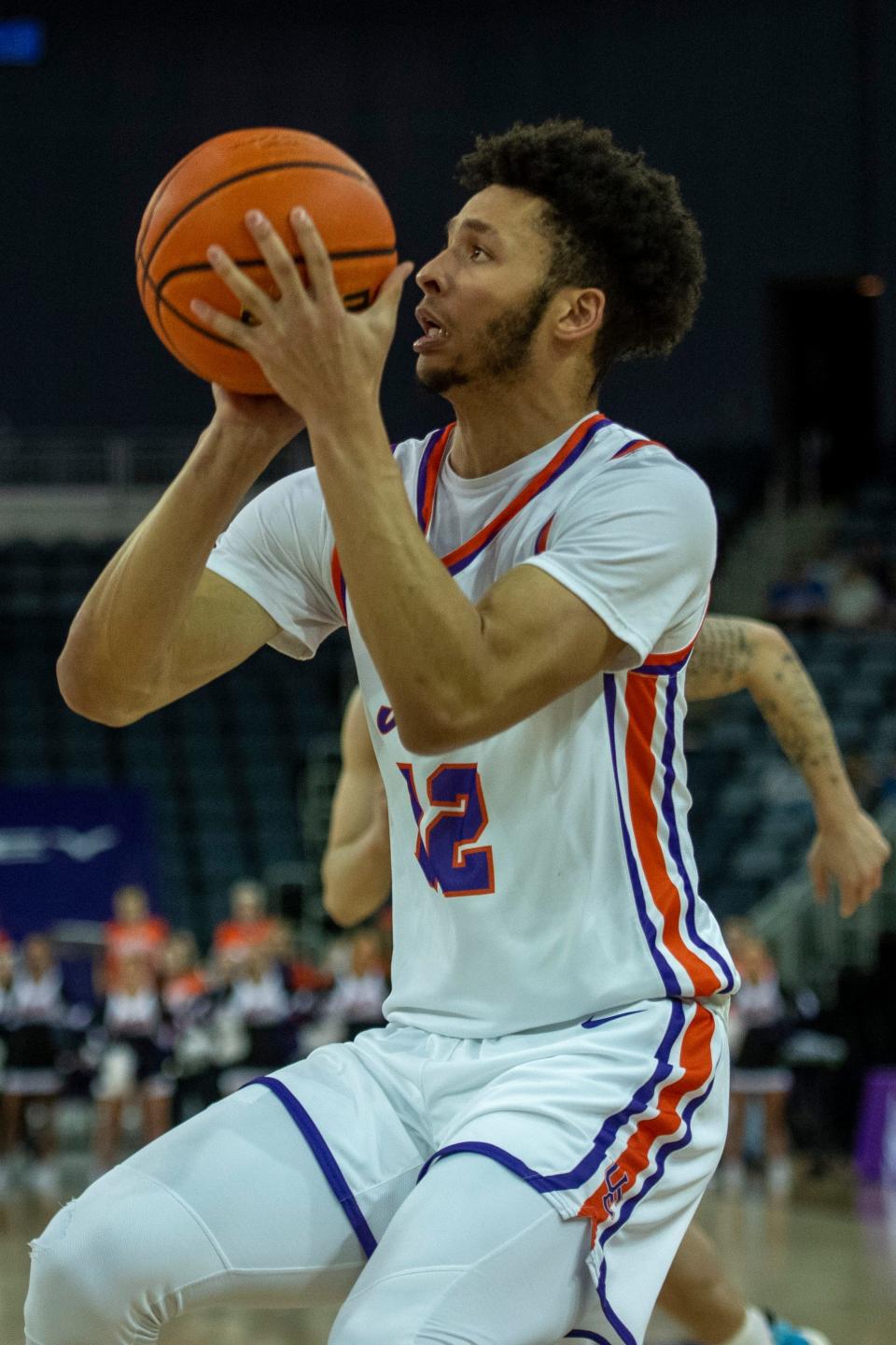 Evansville’s Chris Moncrief (12) takes a shot as the University of Evansville Purple Aces play the University of Illinois at Chicago Flames at Ford Center in Evansville, Ind., Wednesday, Feb. 22, 2023. 