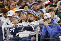 Spectators look on during the second half of an NFL football game between the Dallas Cowboys and the Green Bay Packers, Sunday, Jan. 14, 2024, in Arlington, Texas. (AP Photo/Michael Ainsworth)