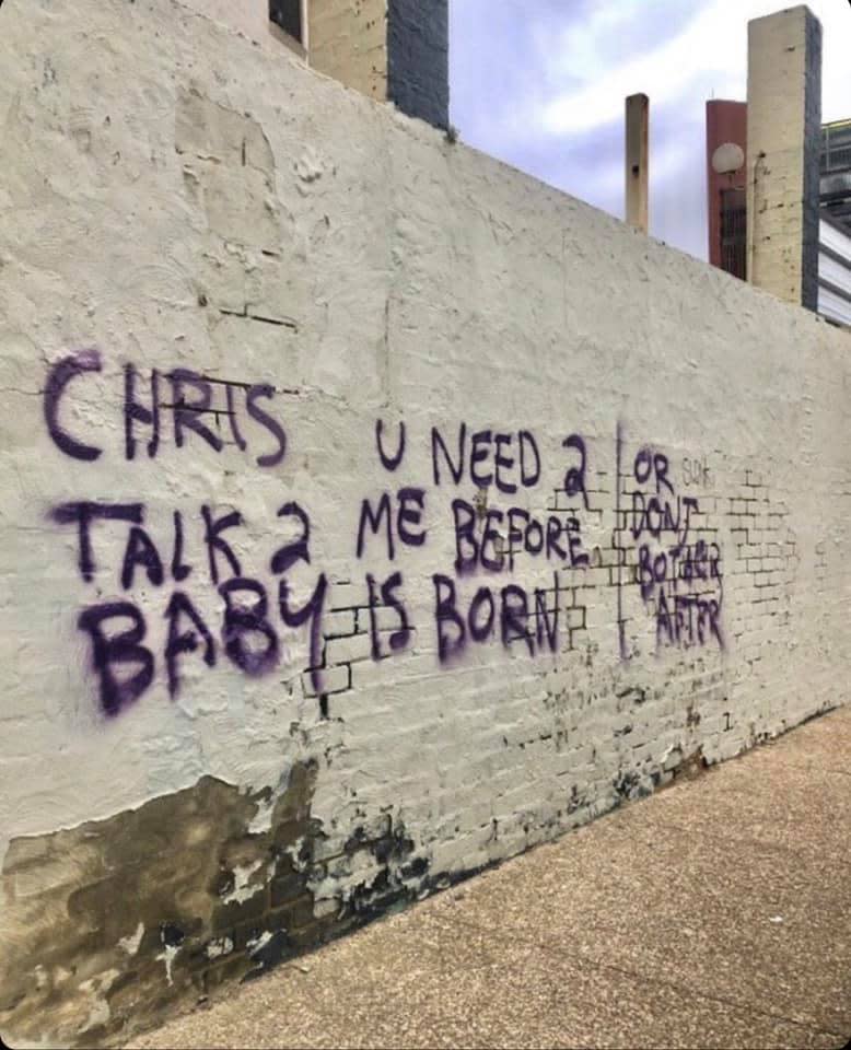 Purple graffiti seen on a bagged  wall in Frankson. 