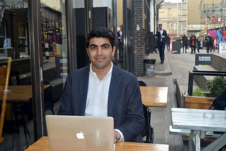 British-Iranian Ali Tehrani, a 24-year-old University College of London graduate and founder of start-up firm KeyPursuit, poses for a photograph at a cafe in London, Britain, in this picture taken March 22, 2016. REUTERS/Pamela Barbaglia