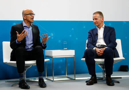 Microsoft CEO Satya Nadella and Volkswagen CEO Herbert Diess address a news conference in Berlin, Germany February 27, 2019. REUTERS/Fabrizio Bensch