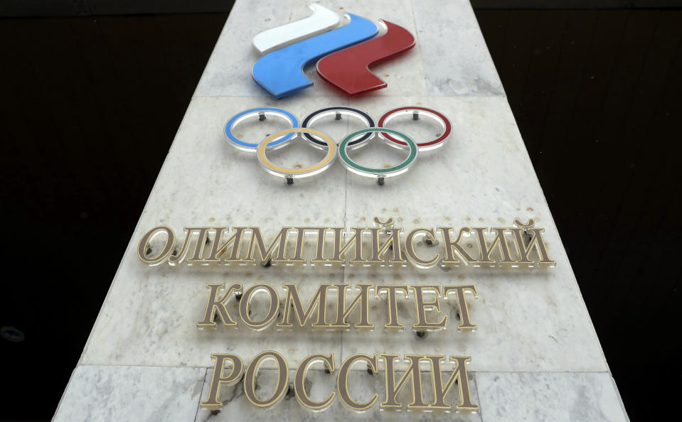 FILE - In this file photo dated Wednesday, Dec. 6, 2017, the logo of the Russian Olympic Committee at the entrance of the head office in Moscow, Russia. The World Anti-Doping Agency banned Russia on Monday Dec. 9, 2019 from the Olympics and other major sporting events for four years, though many athletes will likely be allowed to compete as neutral athletes. (AP Photo/Pavel Golovkin, FILE)