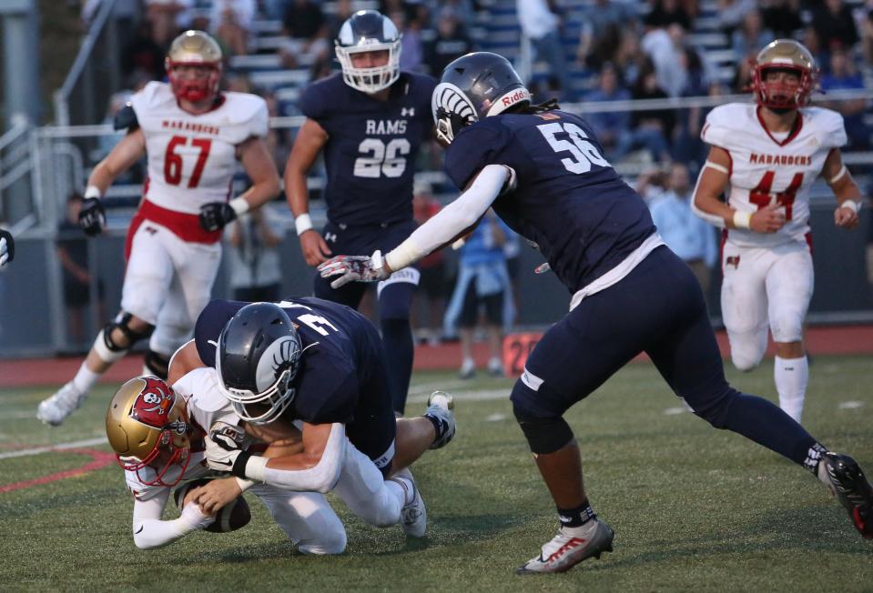 RandolphÕs Dean Mangiocavallo sacks Mount OliveÕs Jake Asbury during the first half of a football game at Randolph High School September 02, 2022.