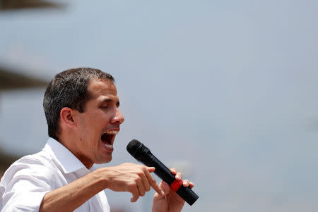 Venezuelan opposition leader Juan Guaido, who many nations have recognised as the country's rightful interim ruler, speaks to supporters during a rally against the government of Venezuela's President Nicolas Maduro and to commemorate May Day in Caracas Venezuela, May 1, 2019. REUTERS/Carlos Garcia Rawlins