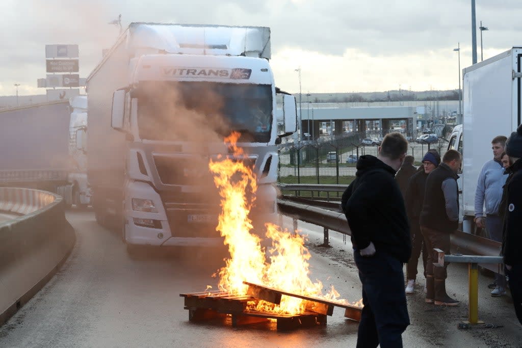 French fishermen block trucks at the Eurotunnel Freight Terminal during a day of protests to mark their anger over the issue of post-Brexit fishing licenses in Coquelles, near Calais (REUTERS)