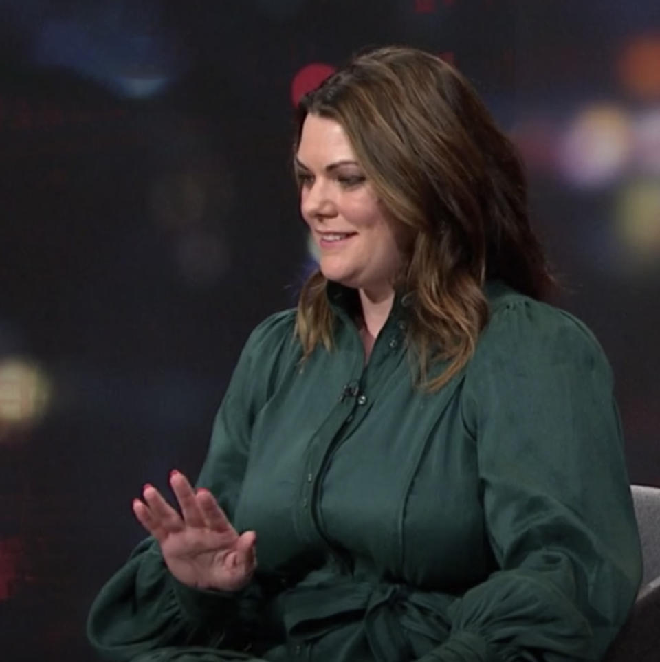 Greens Senator Sarah Hanson-Young holds up her hand in dismay. 