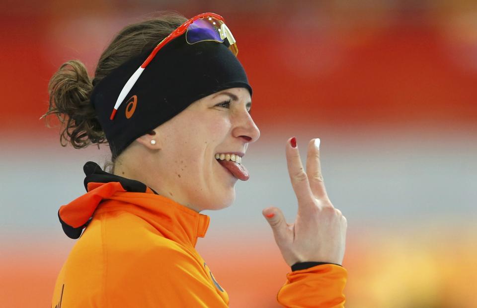 Irene Wust of the Netherlands reacts after realising she has won the women's 3000 meters speed skating event during the 2014 Sochi Winter Olympics, February 9, 2014. REUTERS/Marko Djurica (RUSSIA - Tags: OLYMPICS SPORT SPEED SKATING)