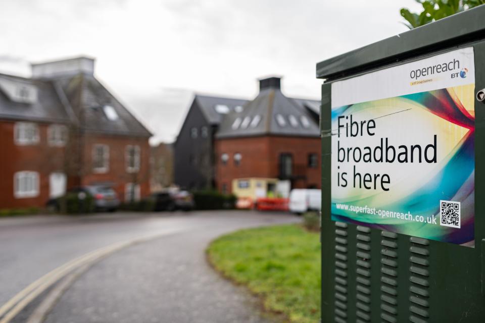 Woodbridge Suffolk UK February 22 2022: A green telecom cabinet advertising the release of fibre broadband in the area