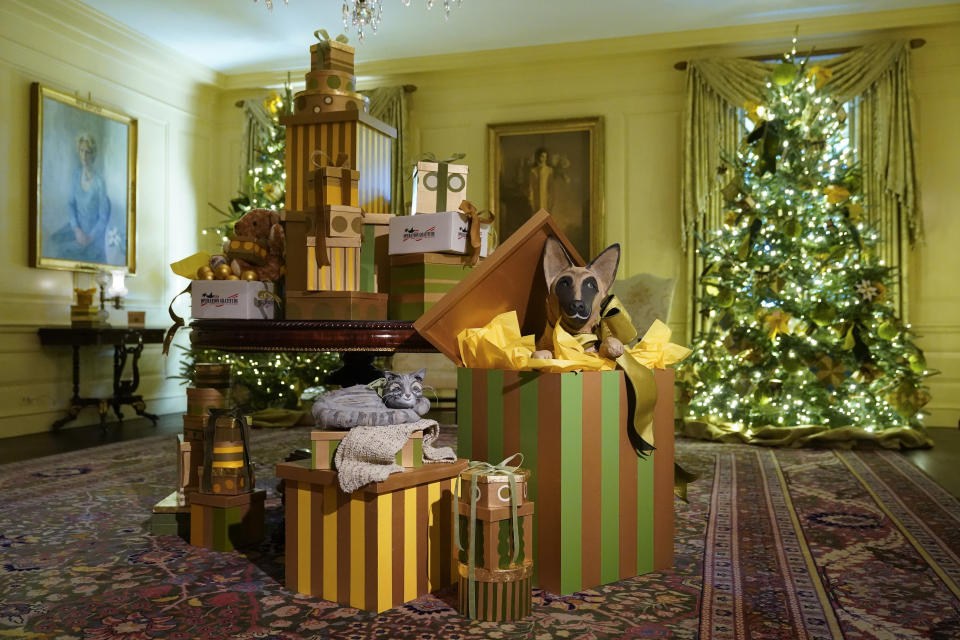 Depictions of Willow, bottom left, and Commander, the Biden family's cat and dog, are part of decorations in the Vermeil Room of the White House during a press preview of holiday decorations at the White House, Monday, Nov. 28, 2022, in Washington. (AP Photo/Patrick Semansky)