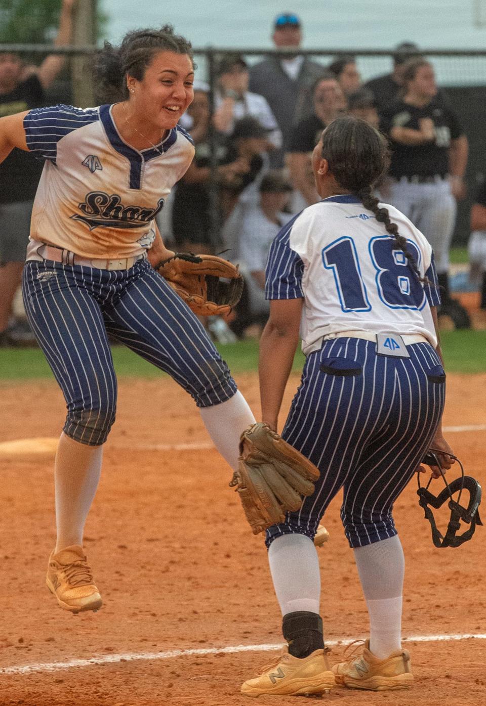 Spanish River High School catcher Isabella Santos (42) and pitcher Giselle Portanova (18) celebrate the team’s win over Lake Brantley High School during their FHSAA State 7A Semi Final softball game at the Legends Way Ball Fields in Clermont Friday. May 26, 2023.