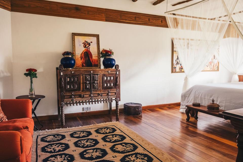 A painting by a Kenyan artist stands on a chest in another bedroom.